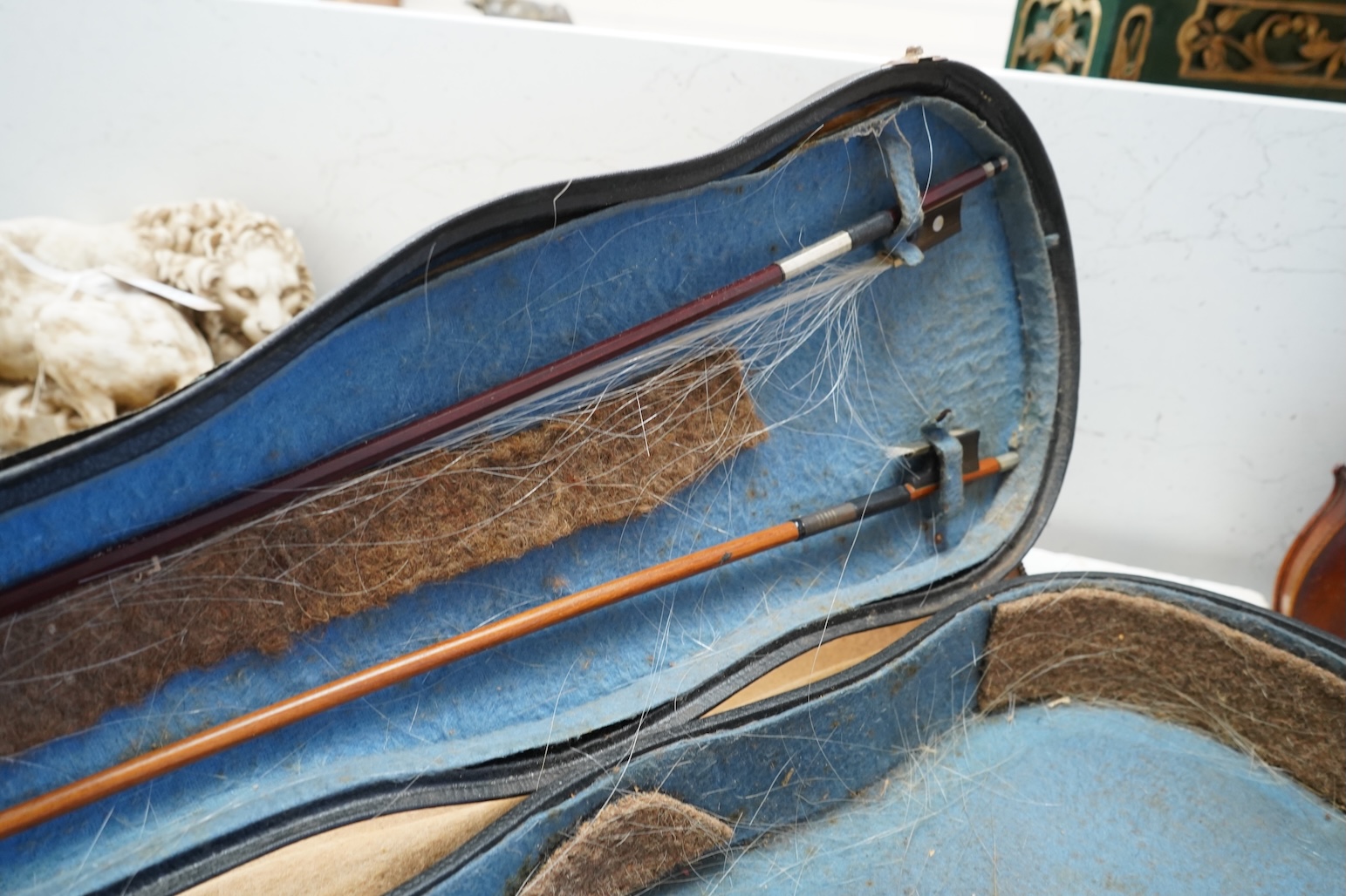 An early 20th century cased violin and cover, 60cm long